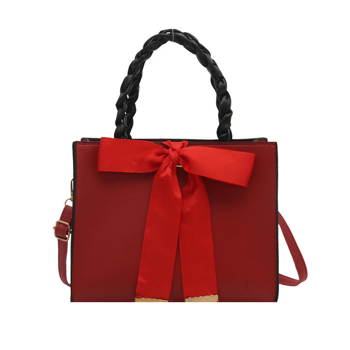 Damen elegante Handtasche mit geflochtenem Ledergriff und Schleifenakzent Nord Taschen