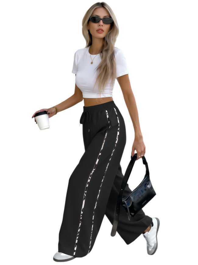 Damen Weite High‑Waist Loungehose mit Kordelzug und kontrastierenden Seitenstreifen Nord Taschen