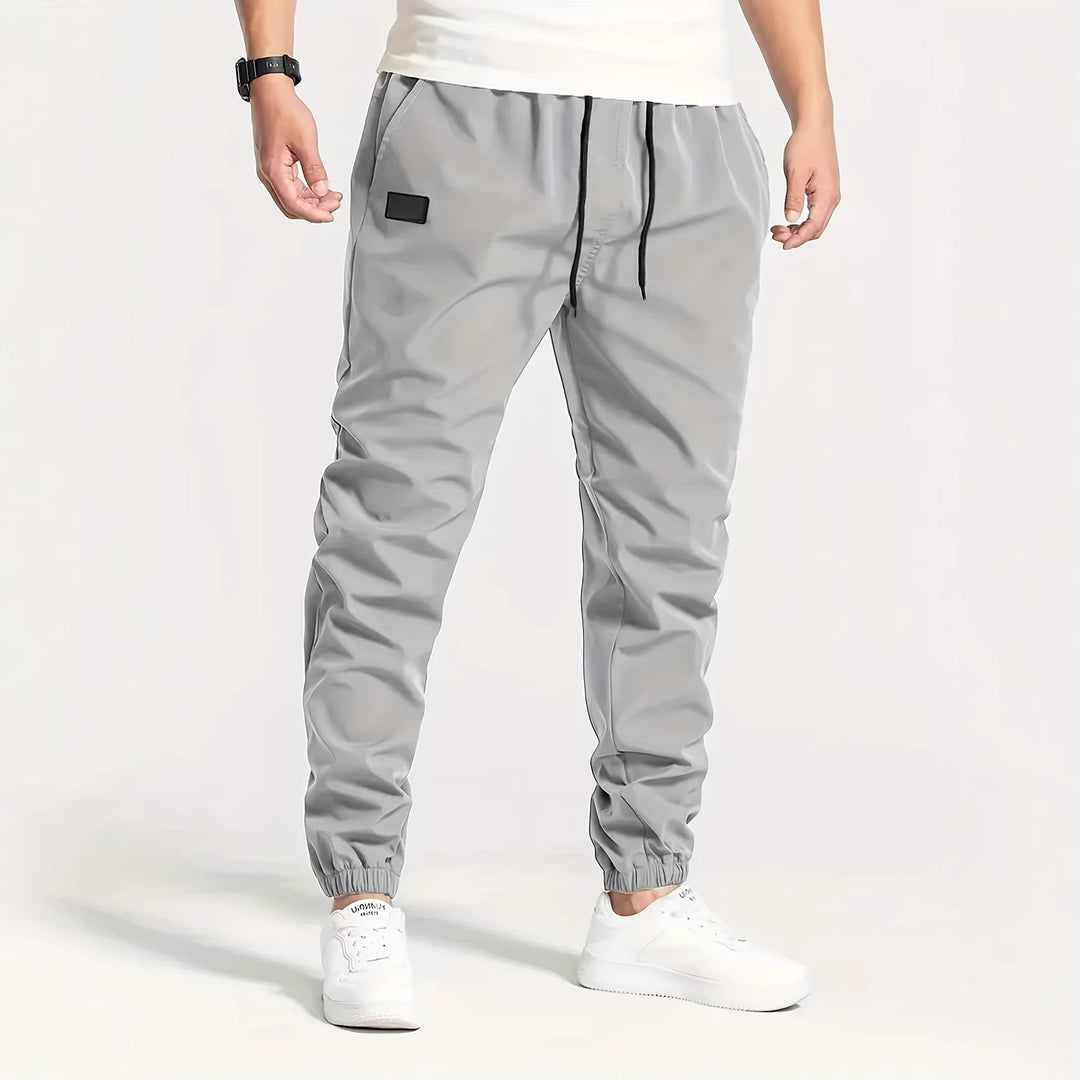 Herren Technische Jogginghose im Tapered‑Utility‑Stil mit elastischem Bund & Knöchelbündchen Nord Taschen