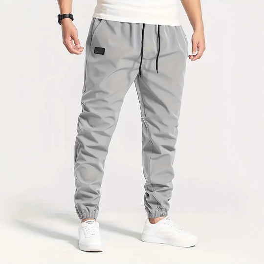 Herren Technische Jogginghose im Tapered‑Utility‑Stil mit elastischem Bund & Knöchelbündchen Nord Taschen