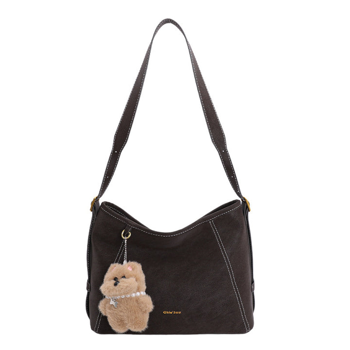 Damen Schultertasche mit verspieltem Tieranhänger und edlem Material Nord Taschen