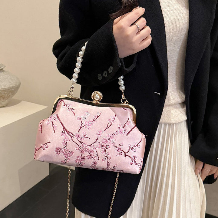 Damen elegante Clutch mit floralen Akzenten Nord Taschen