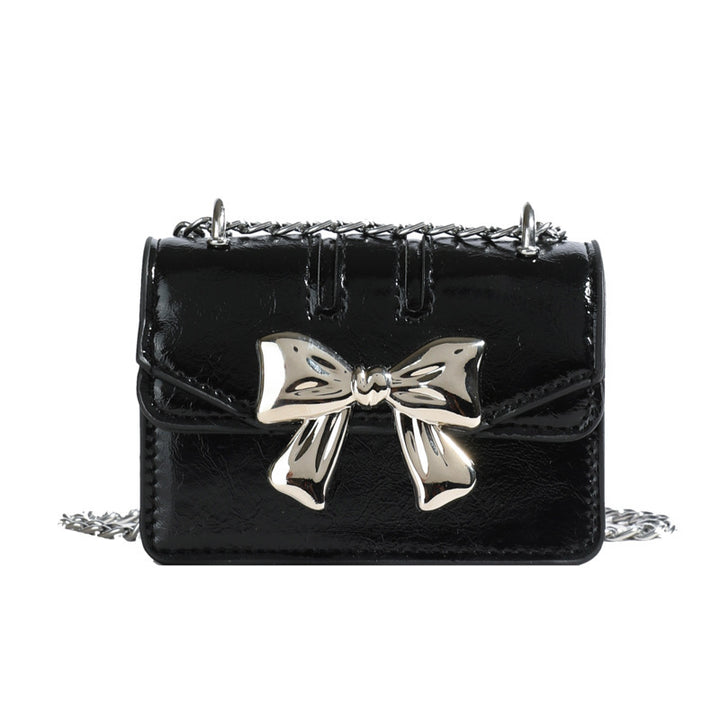 Damen Mini-Handtasche mit schimmerndem Schleifenverschluss Nord Taschen
