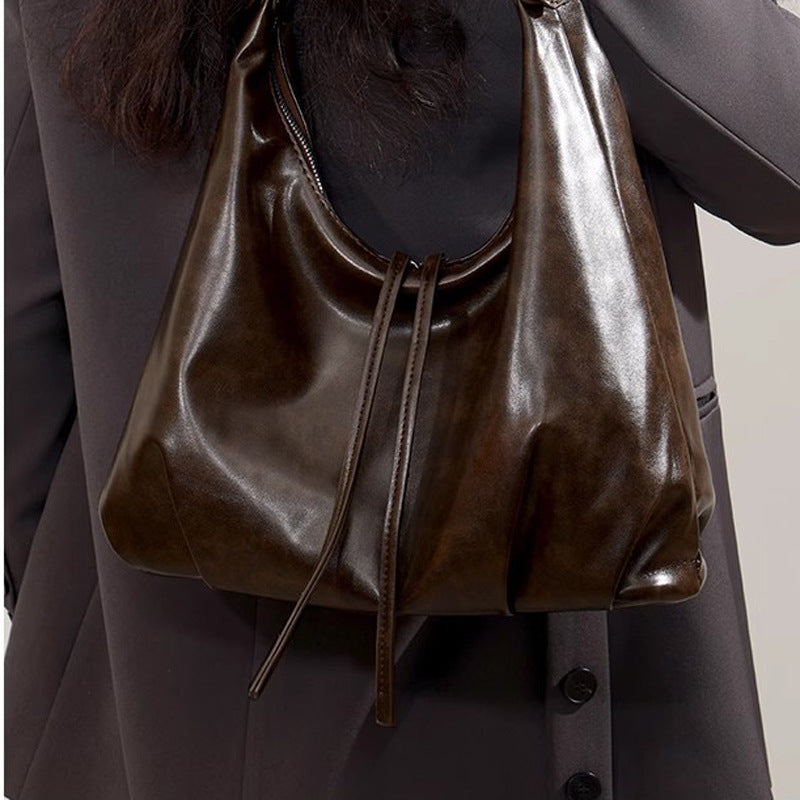 Damen Hobo-Tasche aus hochwertigem Kunstleder mit verstellbarem Schulterriemen und dekorativen Schnürdetails Nord Taschen