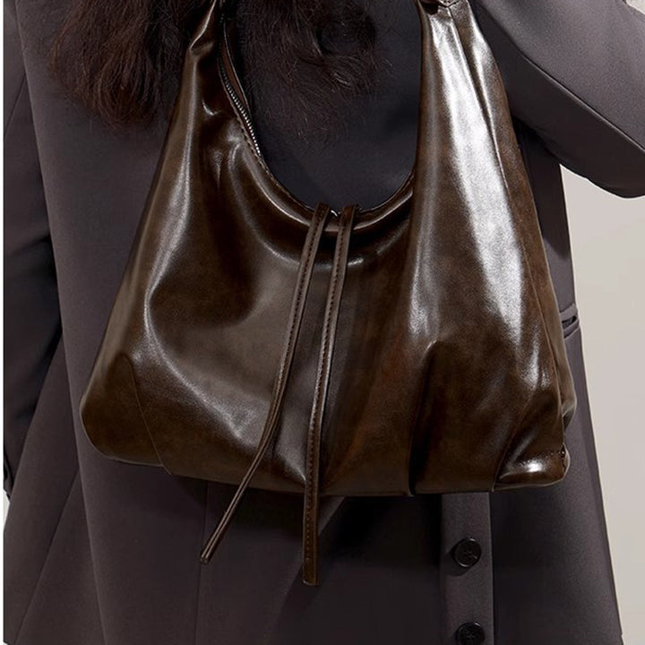 Damen Hobo-Tasche aus hochwertigem Kunstleder mit verstellbarem Schulterriemen und dekorativen Schnürdetails Nord Taschen