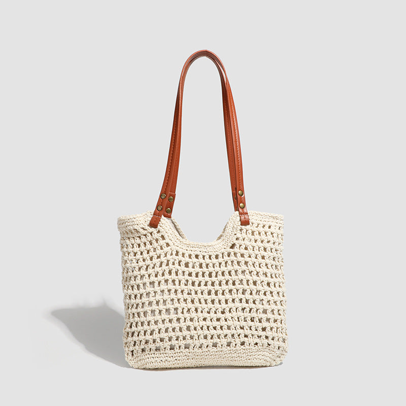 Damen Handtasche aus gewebtem Naturmaterial mit eleganten Lederakzenten Nord Taschen