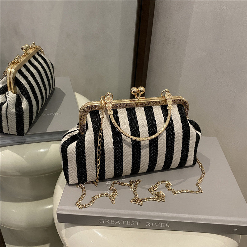 Damen Handtasche mit gestreiftem Design und goldenen Akzenten Nord Taschen