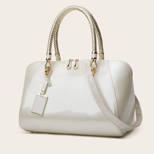 Damen Handtasche mit eleganter Lackoberfläche und geflochtenen Griffen Nord Taschen