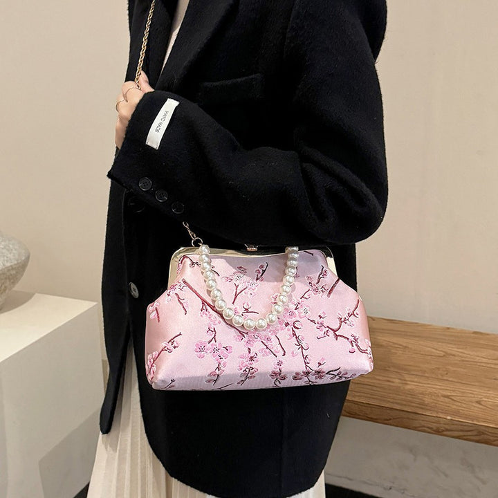 Damen elegante Clutch mit floralen Akzenten Nord Taschen