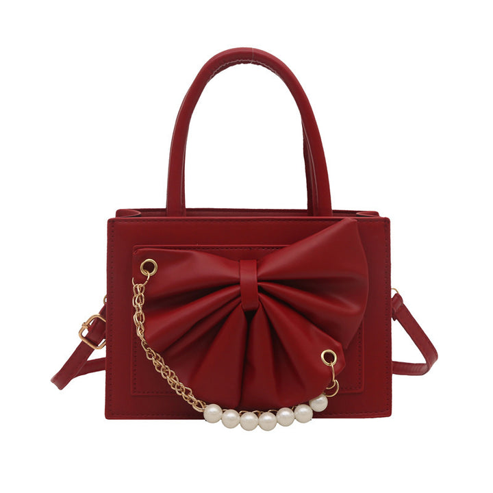 Damen elegante Handtasche mit Schleifenakzent und Perlenverzierung Nord Taschen