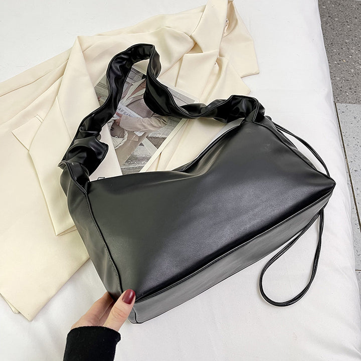 Damenhandtasche mit strukturiertem Polsterdesign und elegantem Tragegriff Nord Taschen