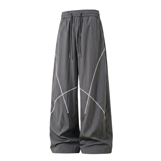 Herren Weite Funktions-Nylonhose mit Kordelbund, reflektierenden Nahtdetails & lässiger Baggy‑Silhouette Nord Taschen