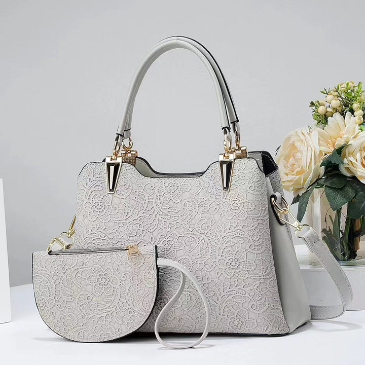 Damen elegante Handtasche mit filigranem Spitzenmuster und abnehmbarer Clutch Nord Taschen