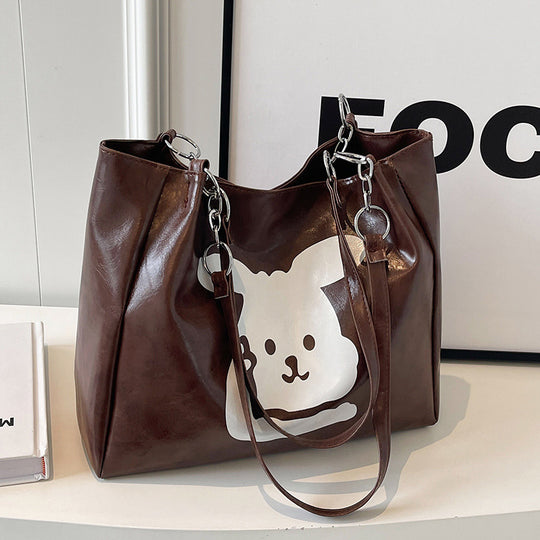 Damen Umhängetasche aus hochwertigem Kunstleder mit verspieltem Tierdesign Nord Taschen