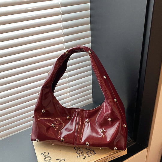 Damen glänzende Handtasche mit strukturiertem Design Nord Taschen