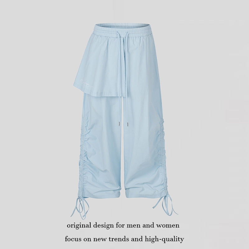 Damen Weite Capri-Hose mit Tunnelzug, seitlicher Raffung und asymmetrischer Überlagerung Nord Taschen
