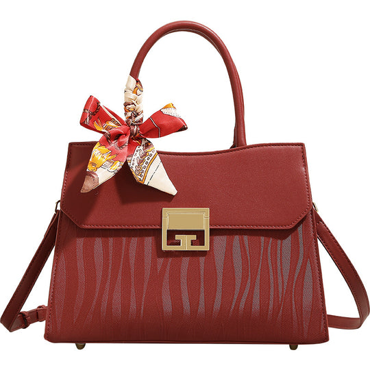Damen Handtasche mit verstellbarem Schulterriemen und elegantem Schleifenakzent Nord Taschen