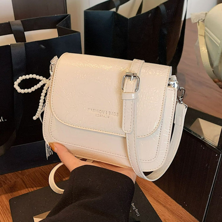 Damen Umhängetasche mit charmantem Spitzen- und Perlenanhänger Nord Taschen