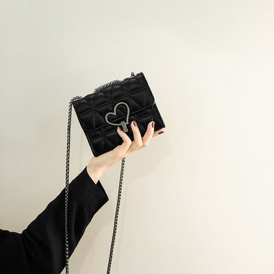Damen Clutch-Tasche mit herzförmigem Verschluss und eleganter Steppung Nord Taschen