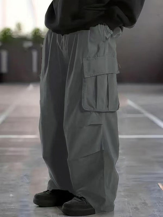 Herren Oversize-Baggy-Cargohose im Urban-Utility-Stil mit elastischem Tunnelzugbund und Mehrfachklappentaschen Nord Taschen