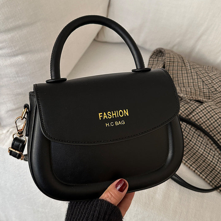 Damen Henkeltasche mit modernem Klappverschluss und eleganten Details Nord Taschen