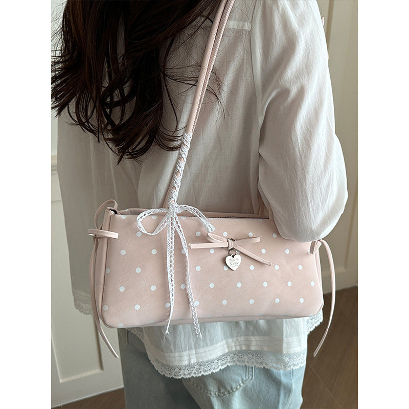 Damen Handtasche mit spielerischem Punktemuster und eleganten Details Nord Taschen