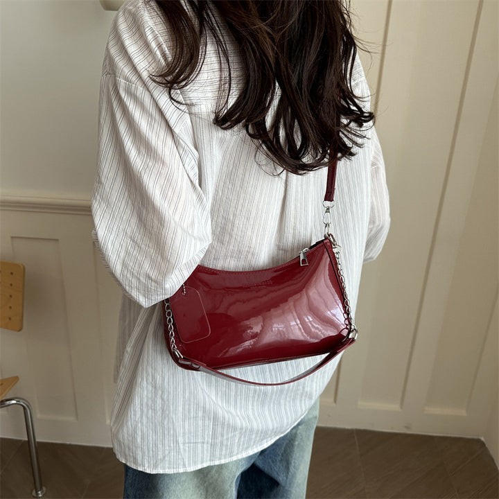 Damen elegante Umhängetasche mit glänzender Lackoberfläche Nord Taschen
