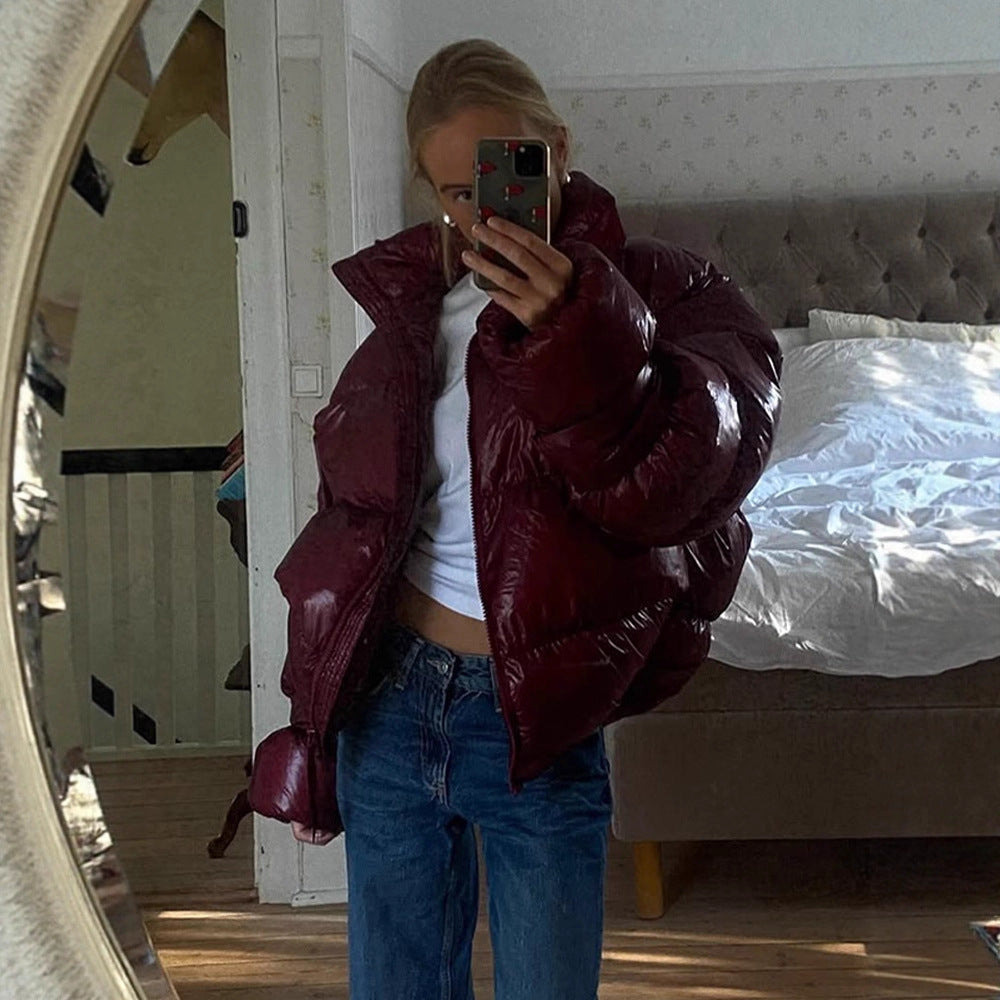 Damen Glänzende Oversize-Steppjacke mit Kapuze und hohem Stehkragen Nord Taschen