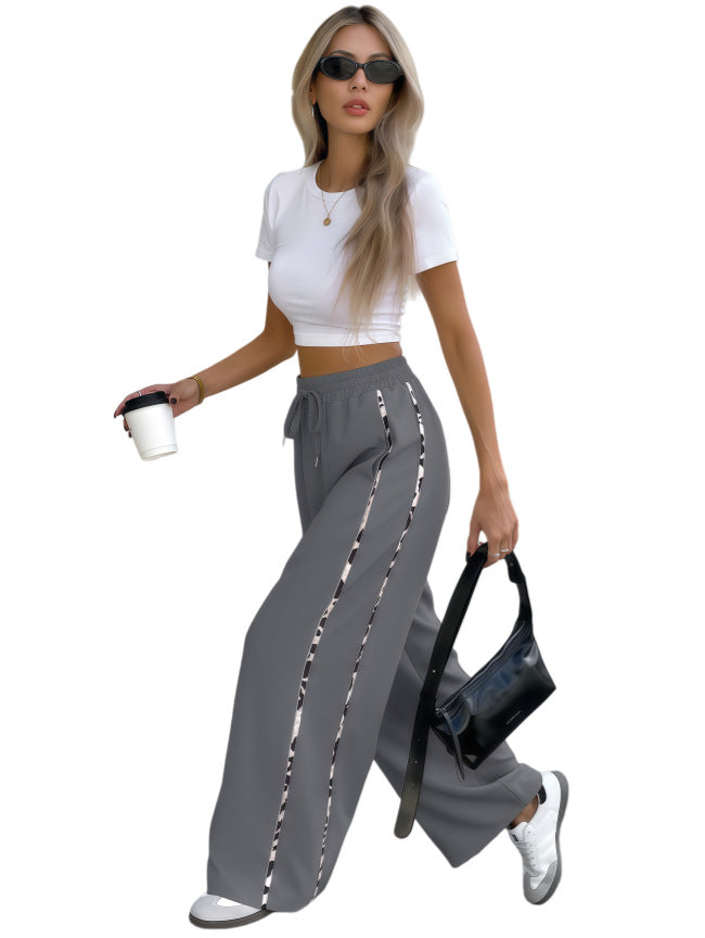 Damen Weite High‑Waist Loungehose mit Kordelzug und kontrastierenden Seitenstreifen Nord Taschen