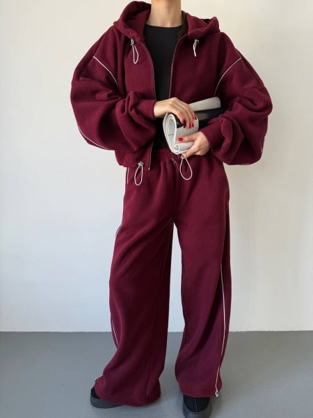 Damen gekürztes Zip-Hoodie mit Tunnelzug und hochgeschnittener weiter Fleece-Loungehose Nord Taschen