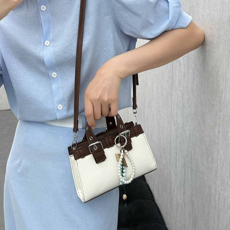 Damen Mini-Handtasche mit verspieltem Anhänger und elegantem Design Nord Taschen