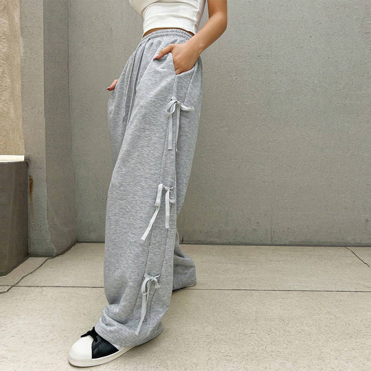 Damen lockere Wide‑Leg Loungehose mit elastischem Bund, Kordelzug und seitlichen Zierschleifen Nord Taschen
