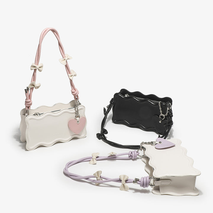 Damen Mini-Handtasche mit kreativem Wellenmuster und verspieltem Anhänger Nord Taschen