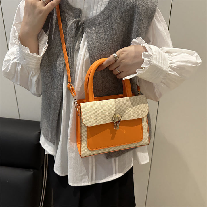 Damen elegante Umhängetasche mit strukturiertem Obermaterial und goldfarbener Verschlussmechanik Nord Taschen