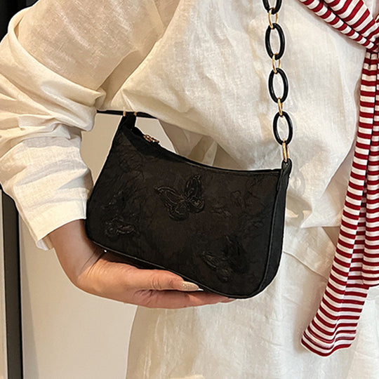 Damen Handtasche mit handgearbeitetem Blumenmuster und modischem Kettenriemen Nord Taschen