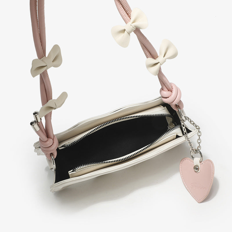 Damen Mini-Handtasche mit kreativem Wellenmuster und verspieltem Anhänger Nord Taschen