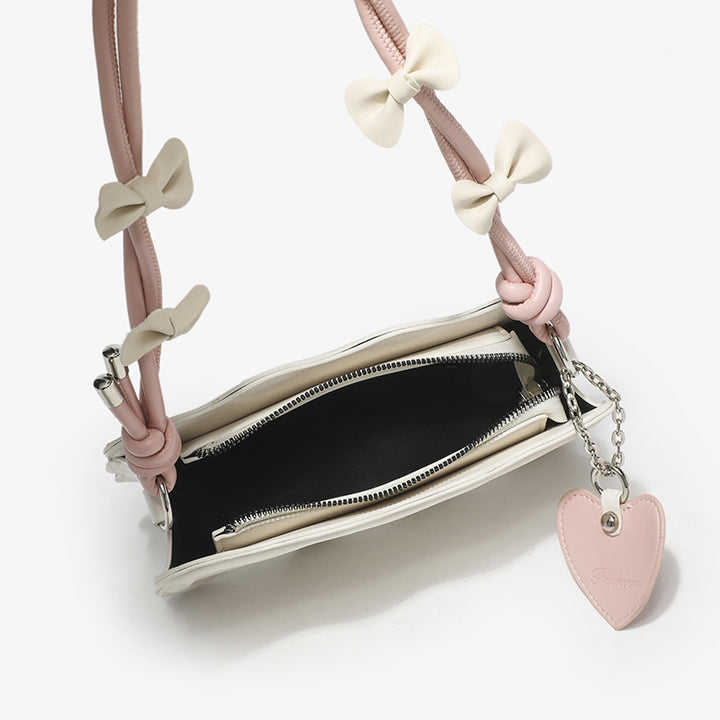 Damen Mini-Handtasche mit kreativem Wellenmuster und verspieltem Anhänger Nord Taschen