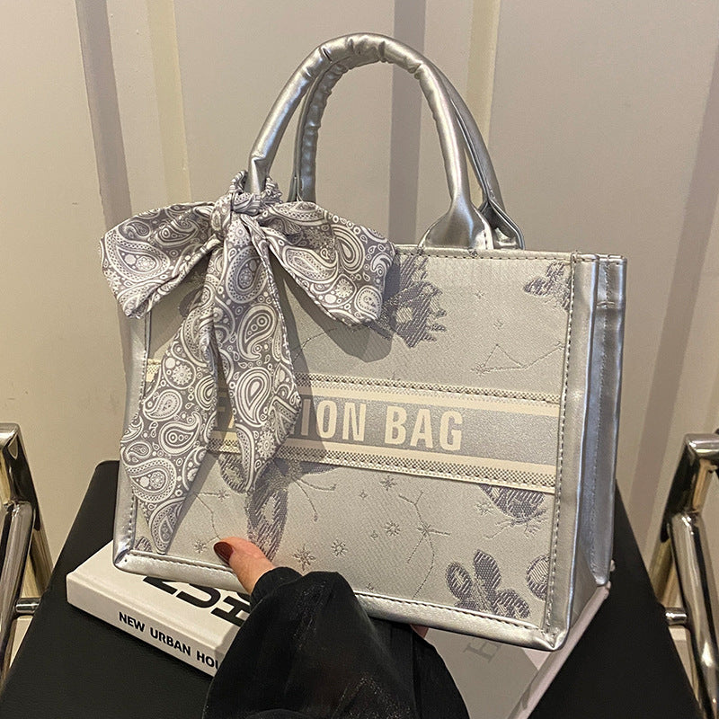 Damen Handtasche im eleganten Design mit dekorativem Schal Nord Taschen