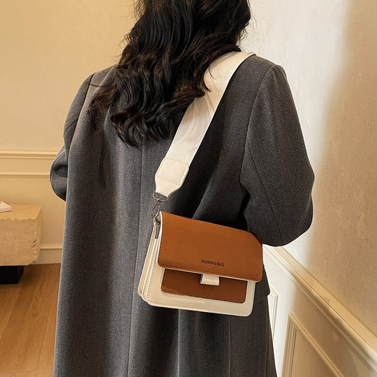 Damen Umhängetasche mit innovativem Klappverschluss und hochwertigen Akzenten Nord Taschen