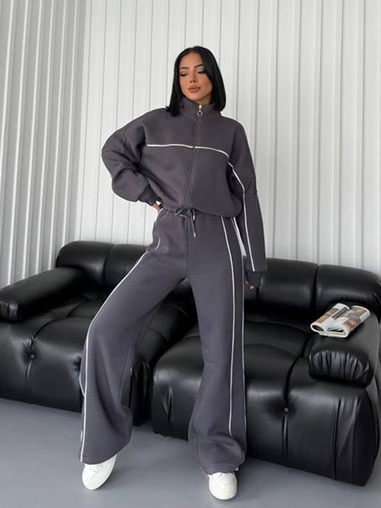 Damen lässiges Sweatset mit Stehkragen Reißverschluss gekürzter Jacke und hochtaillierter Schlaghose Nord Taschen