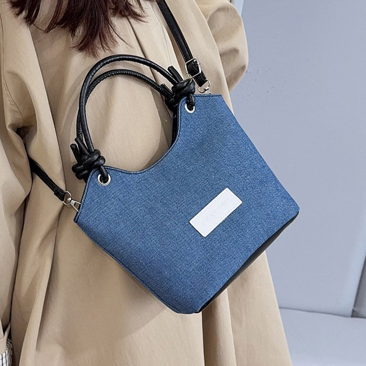 Damen Handtasche aus strapazierfähigem Denim mit eleganten Lederdetails Nord Taschen