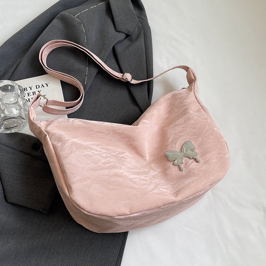 Damen Umhängetasche aus leichtem Material mit dekorativem Schmetterlingsdetail Nord Taschen