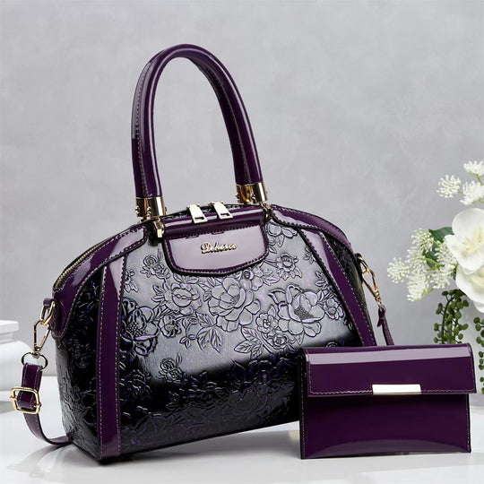 Damen modische Handtasche mit floralen Prägungen und Glanz-Akzenten Nord Taschen