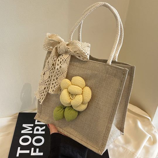 Damen Jute-Handtasche mit floralem Akzent und dekorativem Schleifenband Nord Taschen