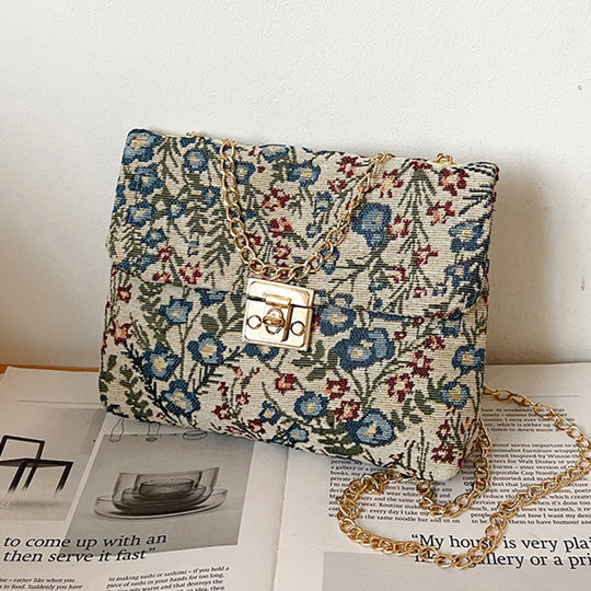 Damen Clutch-Tasche mit floralem Stoffdesign und goldener Kettenverzierung Nord Taschen