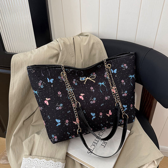 Damen Einkaufstasche mit floralem Design und elegantem Kettenakzent Nord Taschen