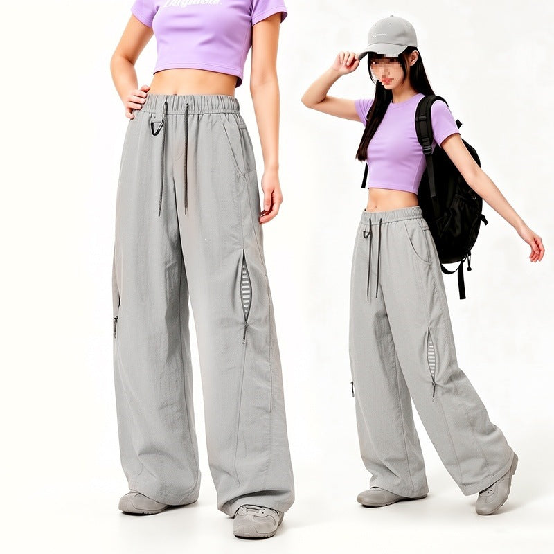 Damen Oversize Tech-Loungehose mit Kontrastnähten, reflektierenden Reißverschlusstaschen & Kordelbund Nord Taschen