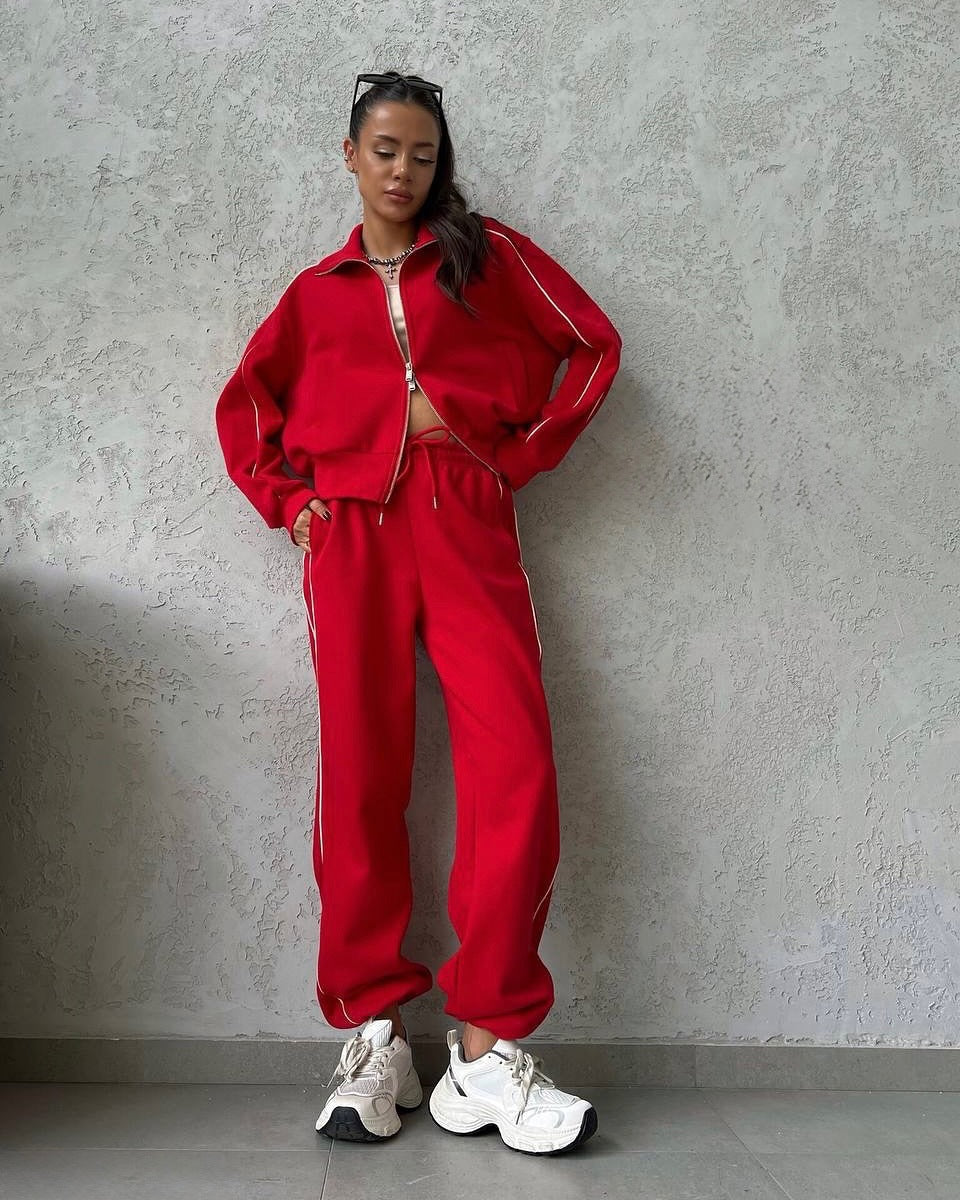 Damen lässiges Sweatset mit Stehkragen Reißverschluss gekürzter Jacke und hochtaillierter Schlaghose Nord Taschen