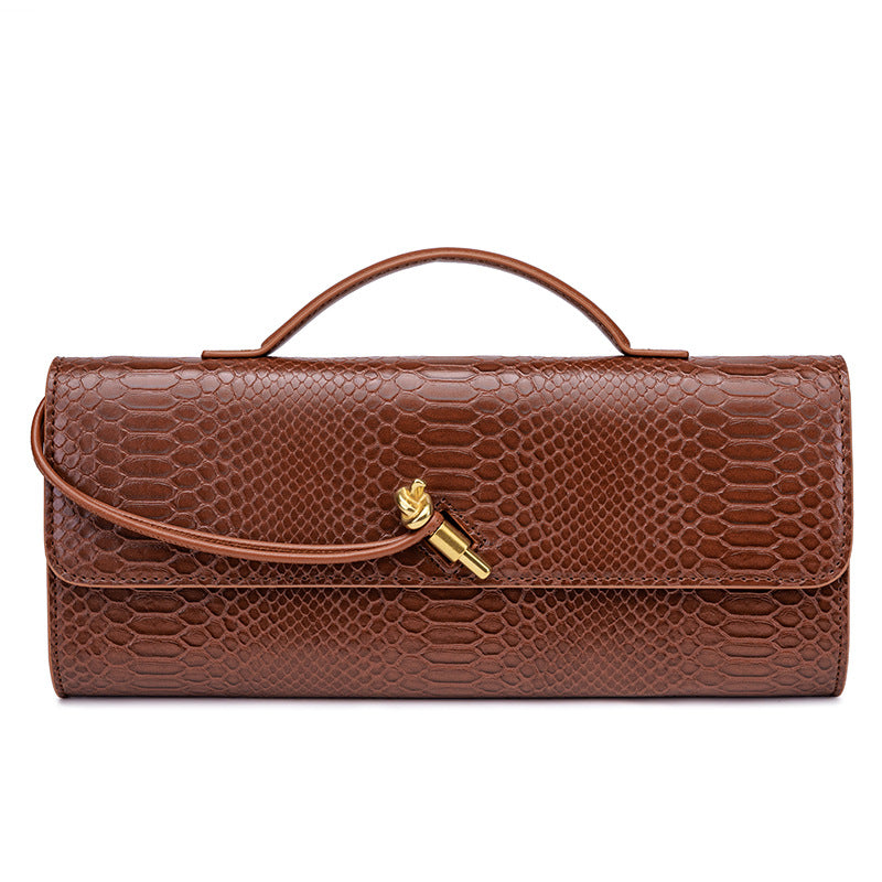 Damen Clutch mit schimmerndem Schlangenhautmuster Nord Taschen