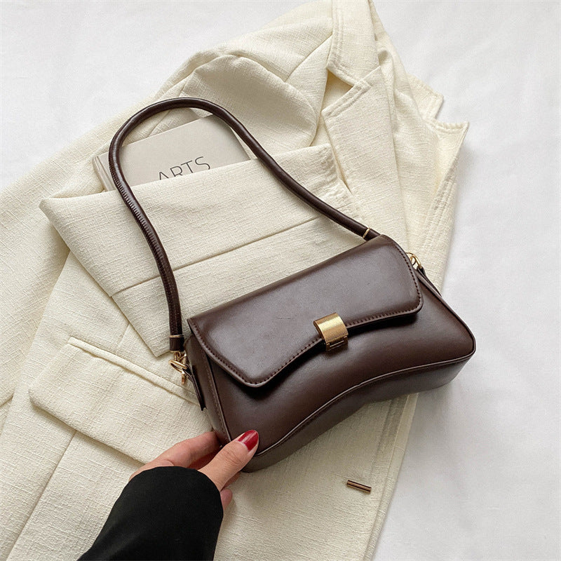 Damen elegante Umhängetasche mit goldener Verschlussmechanik Nord Taschen